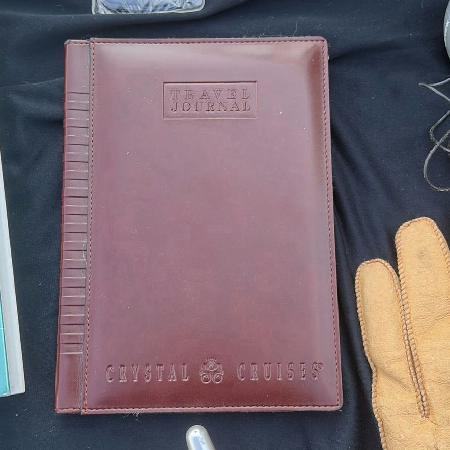 Assorted books, travel journals, and personal accessories - image 11 of 13