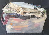 Clear plastic bin with assorted textiles - thumbnail 1 of 5