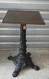 Ornate cast-iron pedestal table with wooden top - thumbnail 1 of 7
