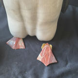 Assorted decorative items including penguin figurines, an ornate tin, a jewelry box with knotted bracelets, a glass sculpture, and round coasters - thumbnail 5 of 8