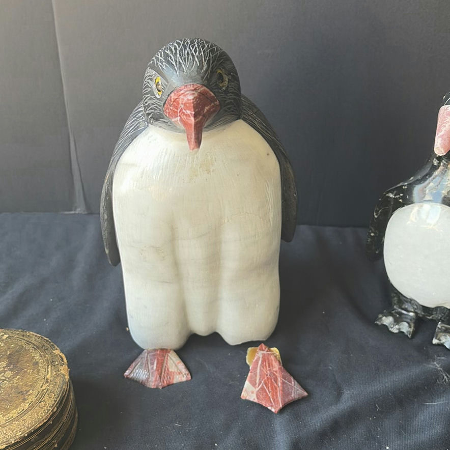 Assorted decorative items including penguin figurines, an ornate tin, a jewelry box with knotted bracelets, a glass sculpture, and round coasters - image 4 of 8