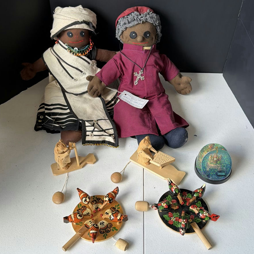 Cloth dolls, wooden folk-art figures, and a glitter globe - image 1 of 8