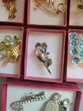 Assorted decorative brooch pins in display boxes - thumbnail 15 of 20