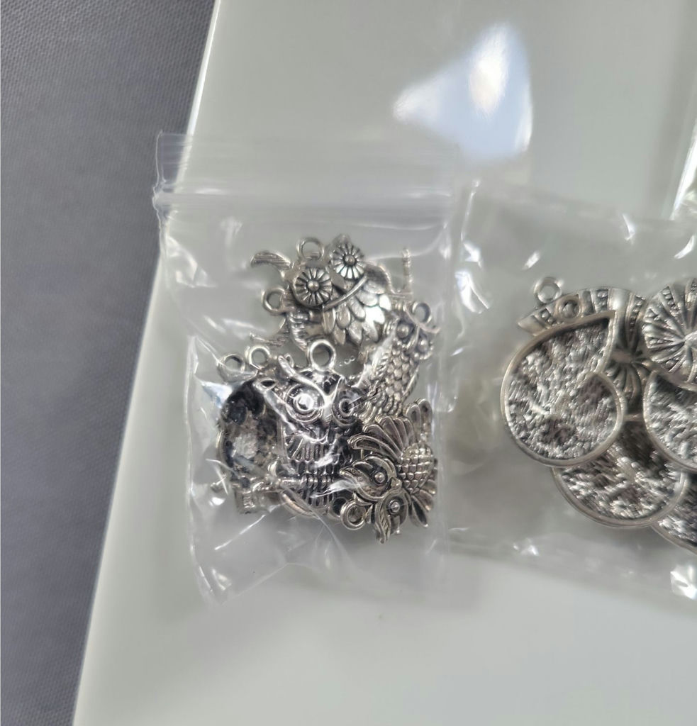 Assorted metal charms and jewelry findings - image 13 of 14