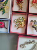 Assorted decorative brooch pins in display boxes - thumbnail 16 of 20