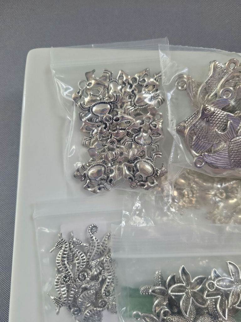 Assorted silver-tone metal charms and pendants - image 2 of 19