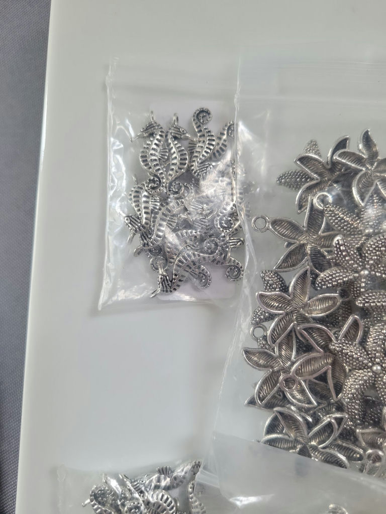 Assorted silver-tone metal charms and pendants - image 9 of 19