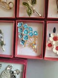 Assorted decorative brooch pins in display boxes - thumbnail 14 of 20