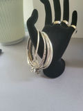 Assorted silver jewelry set: bangles, rings, necklace, and earrings - thumbnail 2 of 15