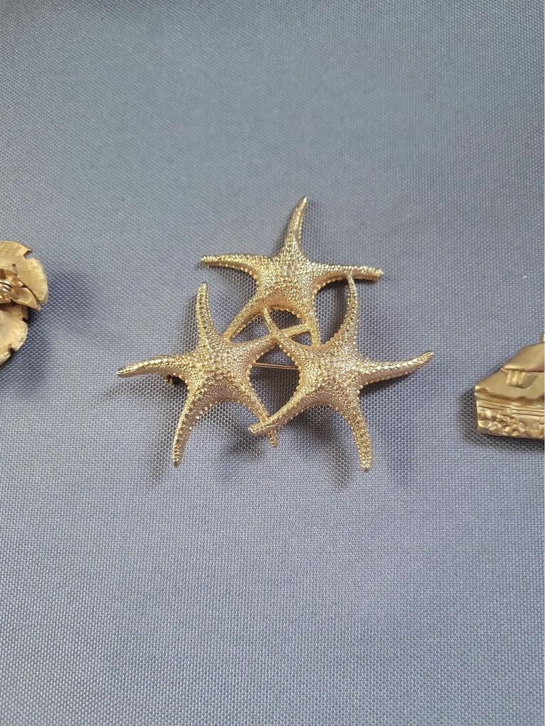 Gold-tone palm tree, starfish, and lighthouse pins - image 5 of 9