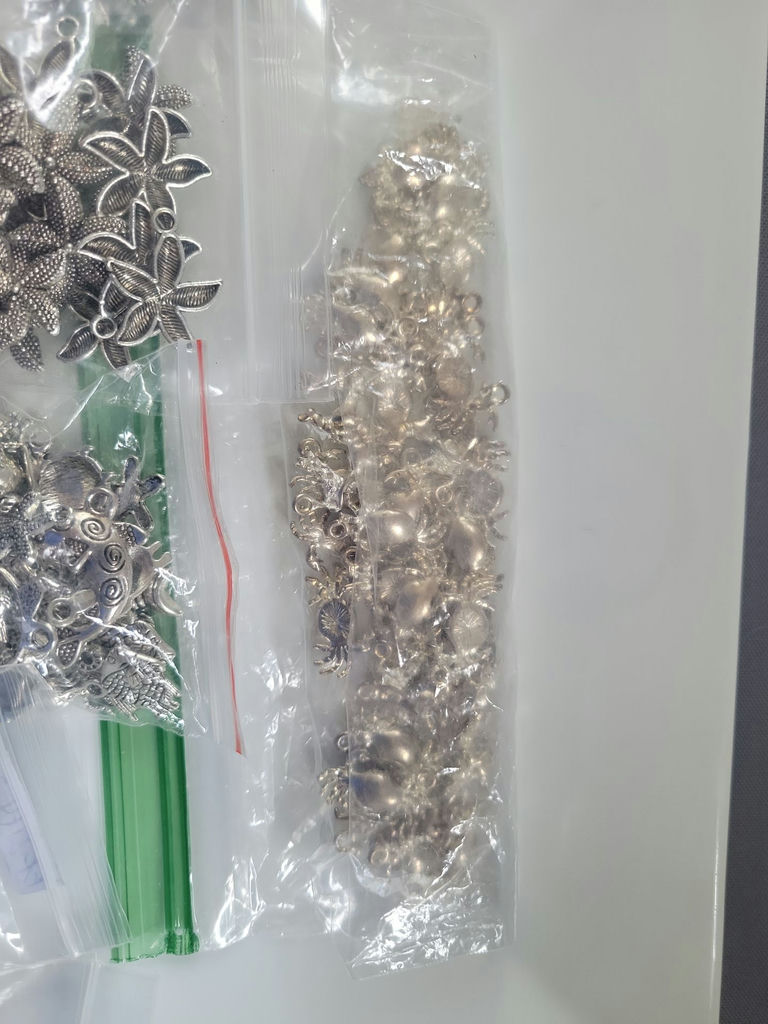 Assorted silver-tone metal charms and pendants - image 8 of 19