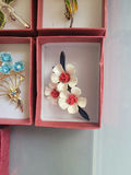 Assorted decorative brooch pins in display boxes - thumbnail 13 of 20