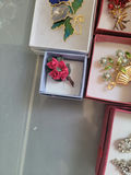 Assorted decorative brooch pins in display boxes - thumbnail 17 of 20