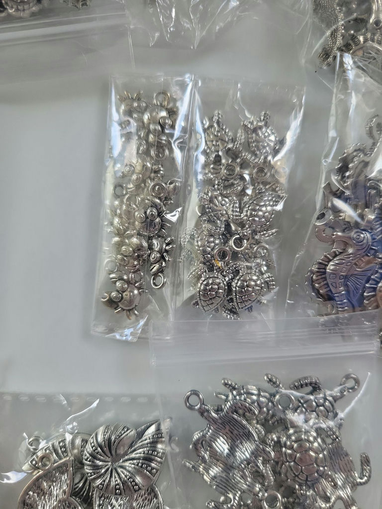 Assorted metal charms and jewelry findings - image 8 of 14