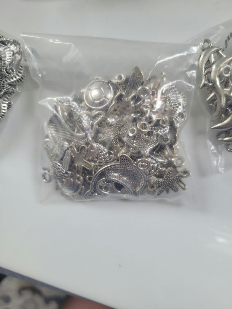 Assorted silver-tone metal charms and pendants - image 15 of 19