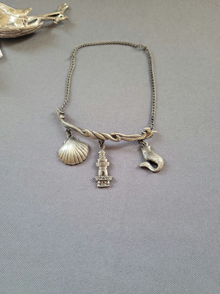Silver jewelry collection with nautical motifs and starfish pendant - image 13 of 18