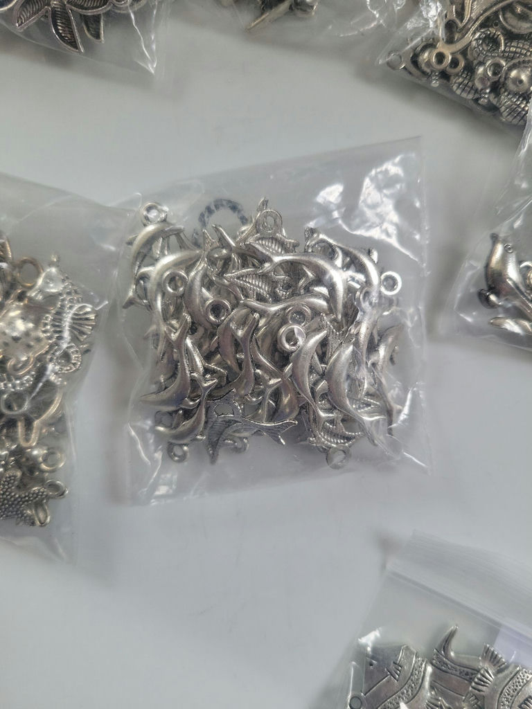 Assorted silver-tone metal charms and pendants - image 16 of 19