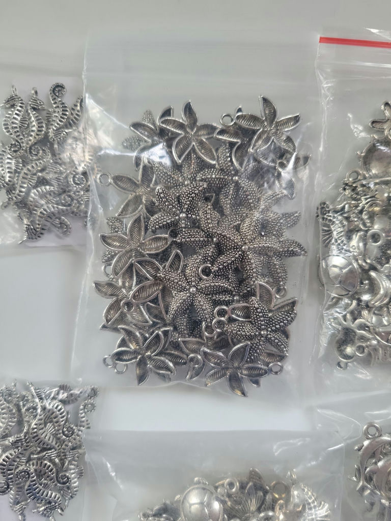 Assorted silver-tone metal charms and pendants - image 10 of 19