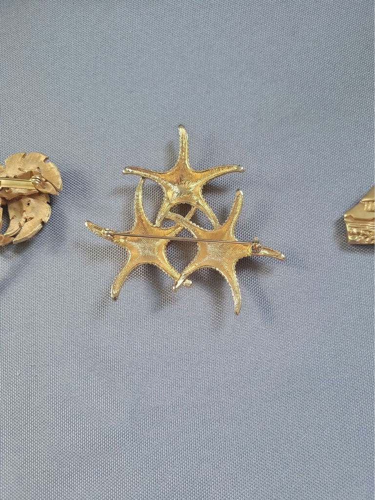 Gold-tone palm tree, starfish, and lighthouse pins - image 6 of 9