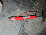 Red handheld manual air pump with hose - thumbnail 1 of 8