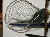 Wall-mounted fishing rod rack with reels, net, and tackle cabinet - thumbnail 2 of 5