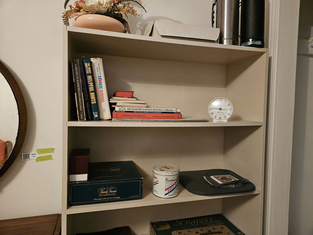 White bookshelf with books and board games - image 4 of 10
