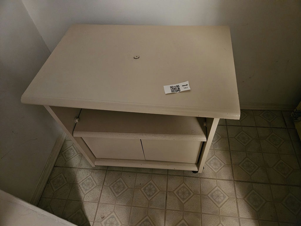 Beige freestanding cabinet with open shelf and double doors - image 1 of 6
