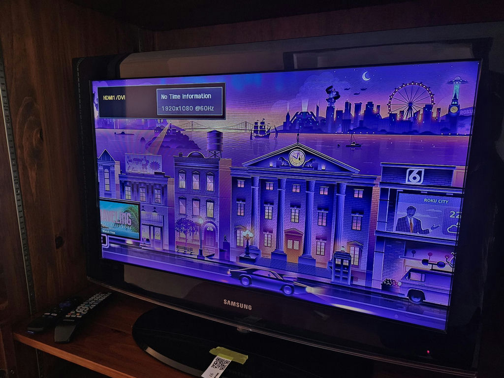 31" Samsung TV with Roku streaming device and remotes - image 1 of 7