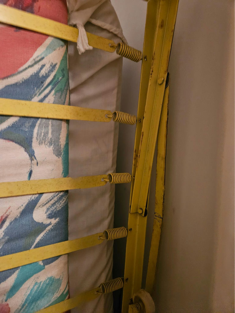 Yellow metal folding bed frame with mattress - image 6 of 7