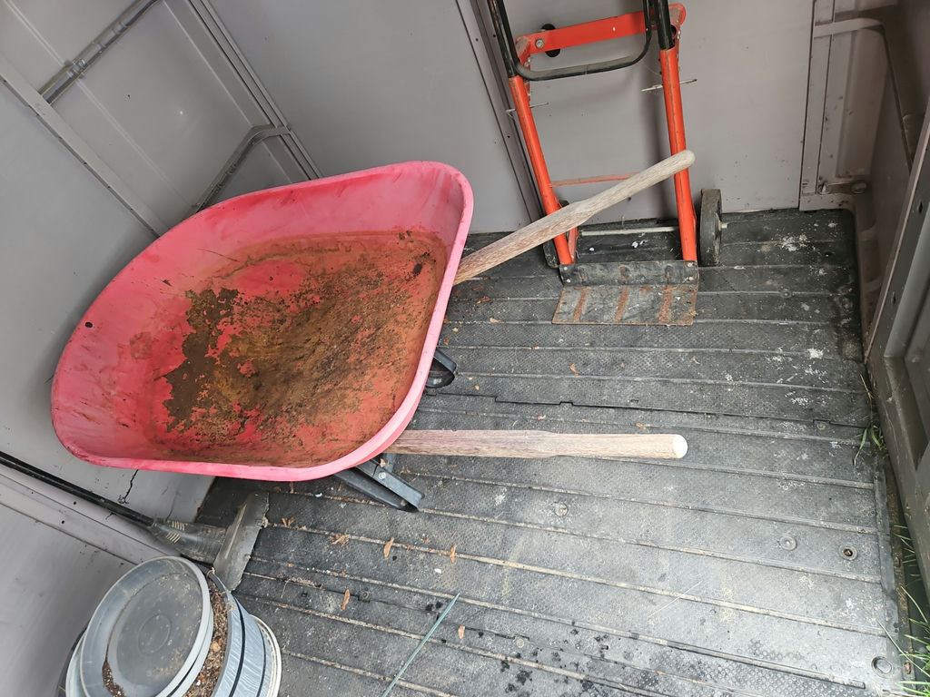 Red wheelbarrow with wooden handles - image 1 of 4