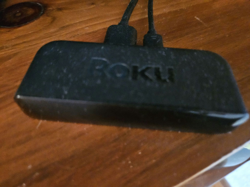 31" Samsung TV with Roku streaming device and remotes - image 6 of 7