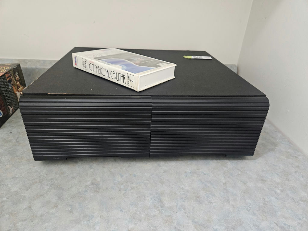 VHS tapes in a black storage cabinet with a Classical Guitar video box - image 5 of 6