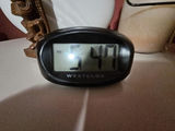 White ceramic vases, a carved tiki statue, a rope-handled jar, and a digital clock - thumbnail 3 of 7