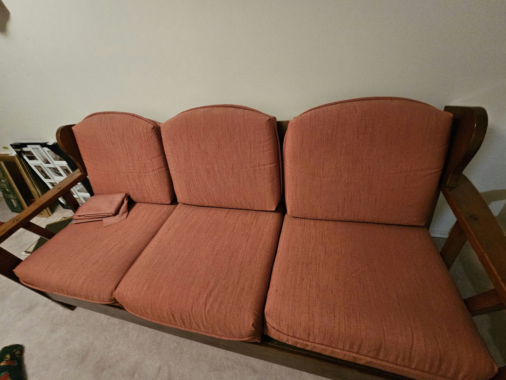 Vintage wooden-framed sofa with coral upholstery and matching armchair - image 5 of 13