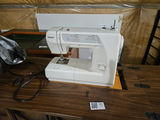 Sewing machine in Mid Century Modernwooden cabinet with sewing supplies - thumbnail 4 of 11
