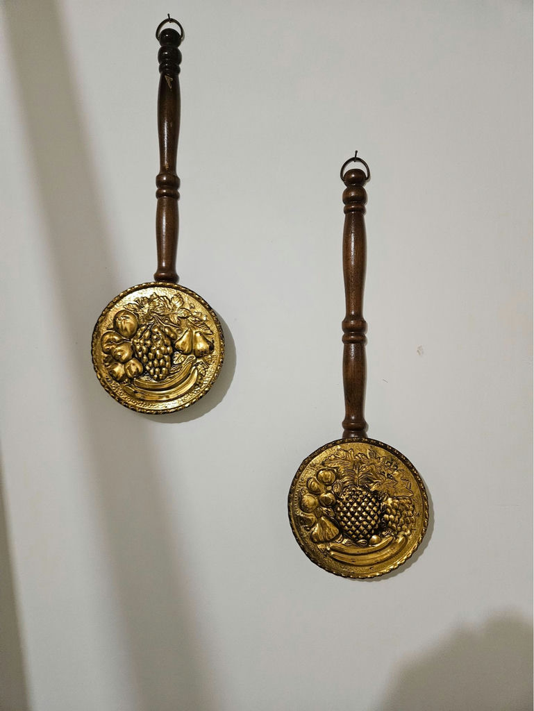 Pair of brass fruit-embossed medallions on wooden handles - image 1 of 5