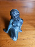 Small metal figurines: two seals, a seated female figure, and a dog - thumbnail 6 of 7