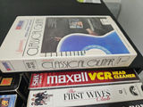 VHS tapes in a black storage cabinet with a Classical Guitar video box - thumbnail 4 of 6