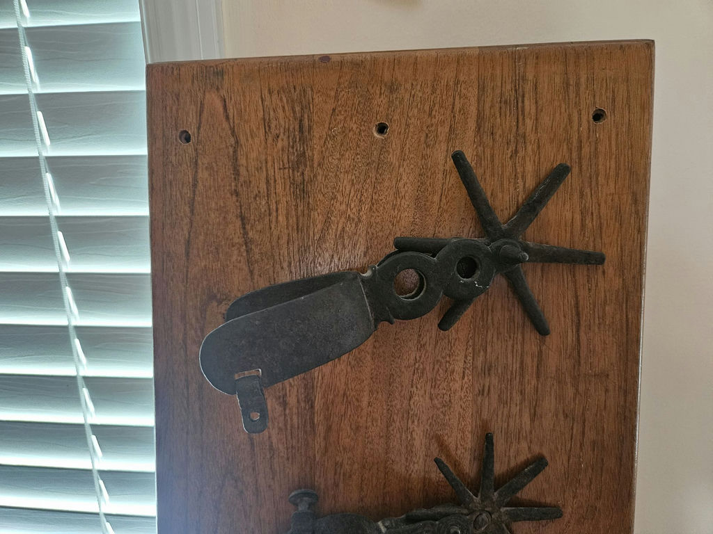 Wooden board with antique horse tack and metal hardware - image 3 of 5