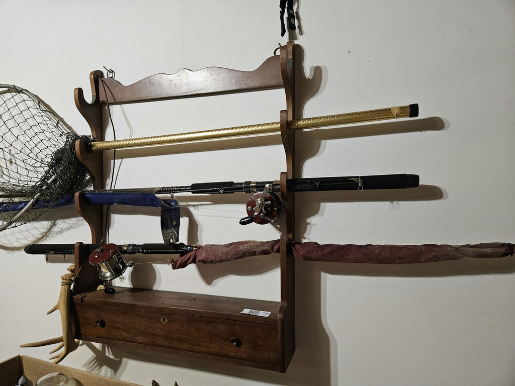 Wall-mounted fishing rod rack with reels, net, and tackle cabinet - image 5 of 5