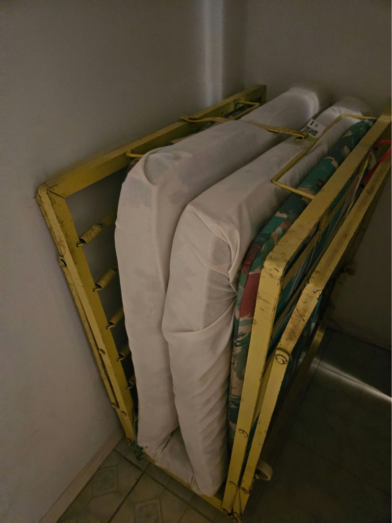 Yellow metal folding bed frame with mattress - image 3 of 7