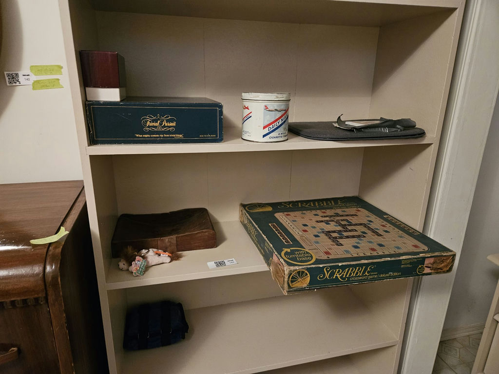 White bookshelf with books and board games - image 3 of 10