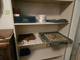 White bookshelf with books and board games - thumbnail 3 of 10