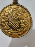 Pair of brass fruit-embossed medallions on wooden handles - thumbnail 2 of 5
