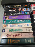 VHS tapes in a black storage cabinet with a Classical Guitar video box - thumbnail 2 of 6
