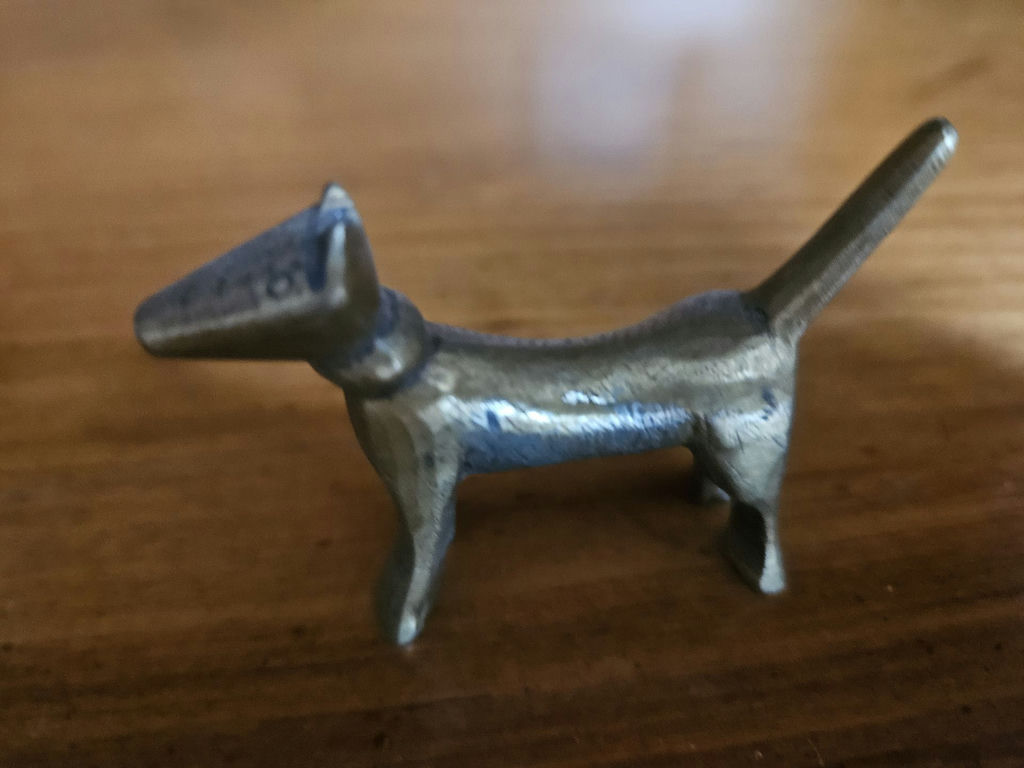 Small metal figurines: two seals, a seated female figure, and a dog - image 4 of 7