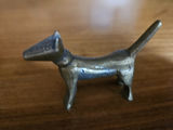 Small metal figurines: two seals, a seated female figure, and a dog - thumbnail 4 of 7