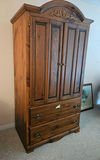 Large wooden armoire with carved crest and drawers - thumbnail 1 of 16