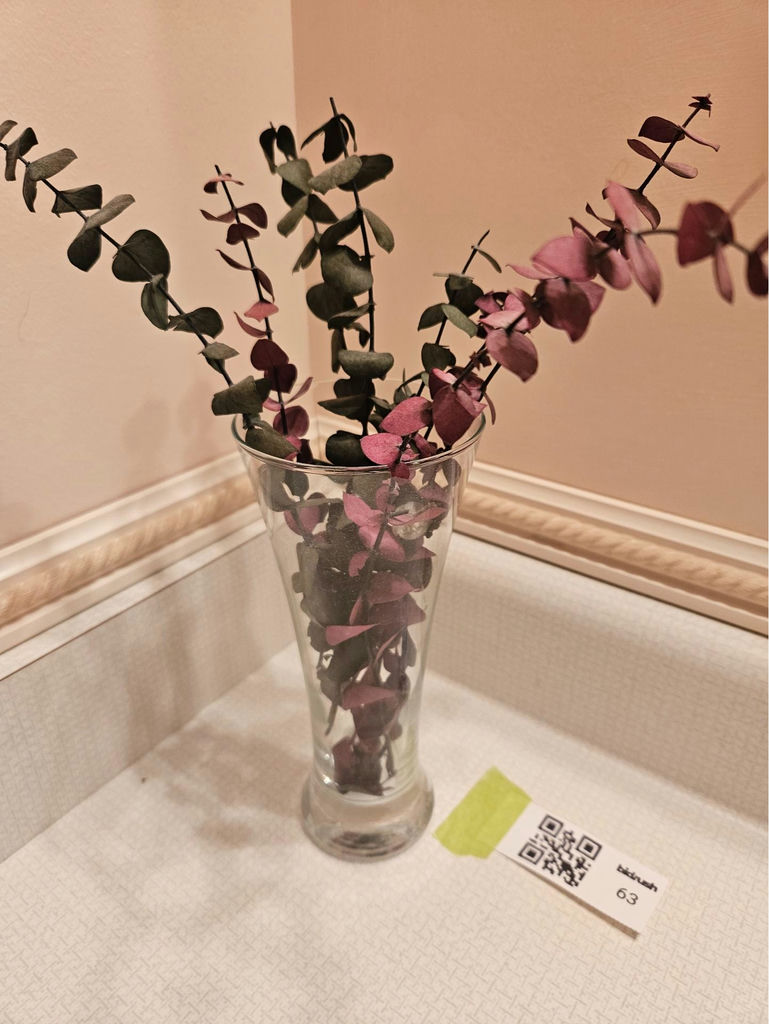 Glass vase with artificial eucalyptus stems - image 1 of 3