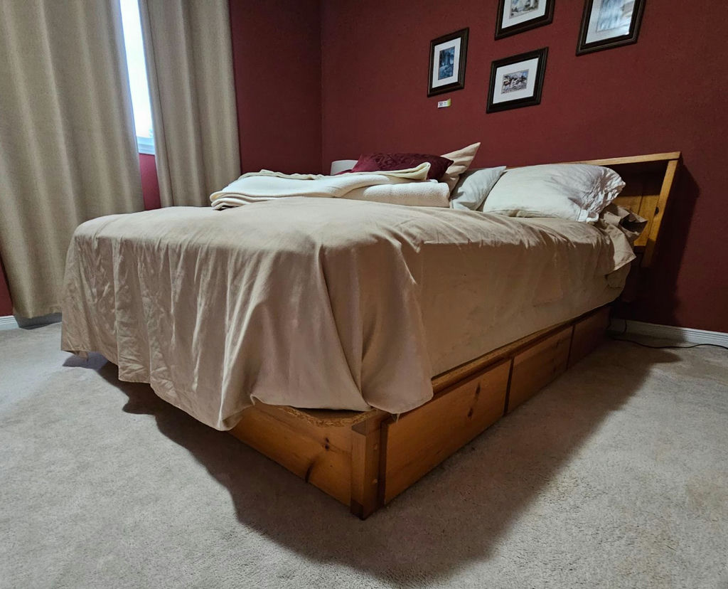 Wooden platform bed with built-in storage and headboard shelves - image 1 of 11